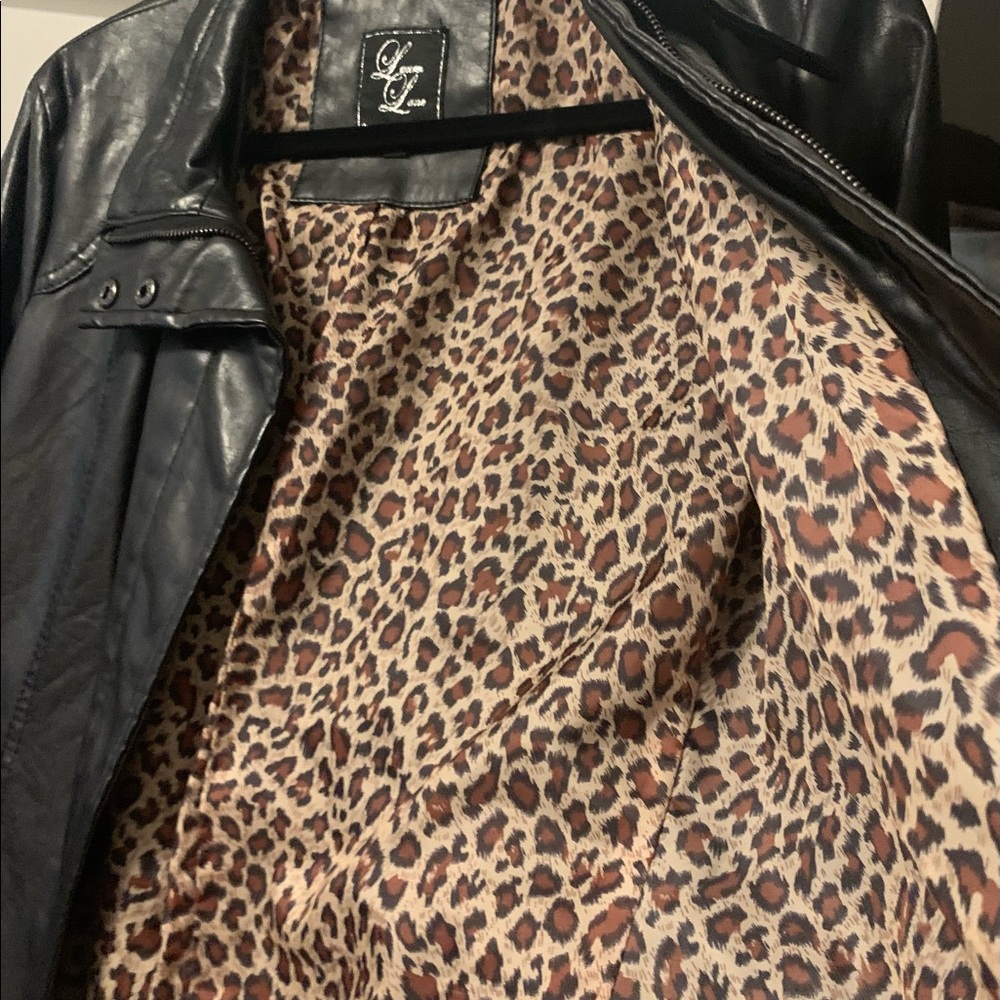 Black jacket with animal print interior